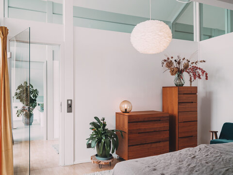 Modern bright bedroom interior in a timber frame construction villa