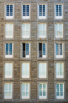 A stone building features a historic window facade in France