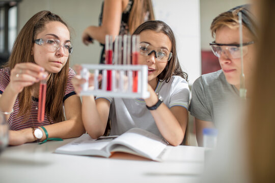 Students in science class experimenting with test tubes