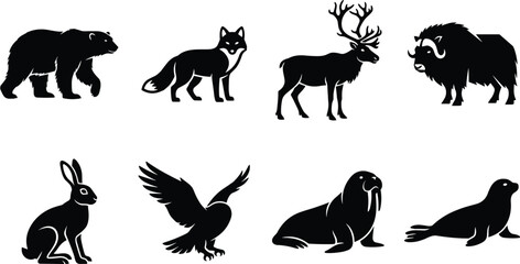 Silhouette illustration set of Arctic animals including bear, fox, reindeer, musk ox, hare, bird, walrus, and seal © Sreemoti