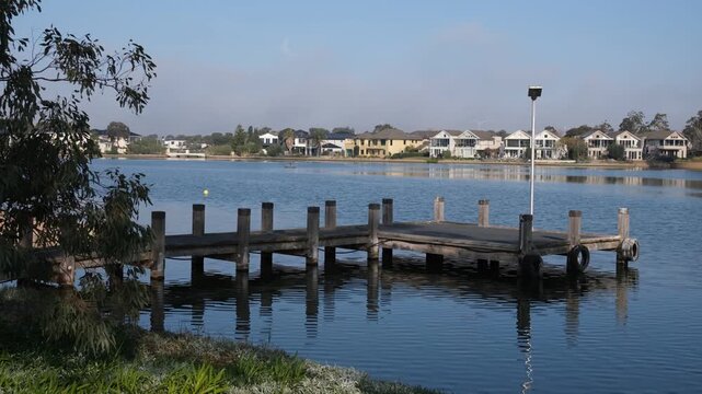 A lake and residential canal system within the master-planned estate of Sanctuary Lakes. Waterfront houses and luxury residential properties line the shoreline. Point Cook, Melbourne, Australia