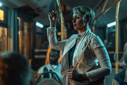 Woman commuting on public transport at night