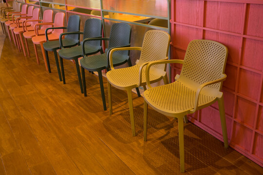 Chairs on row in front of the reataurant for customer to waiting