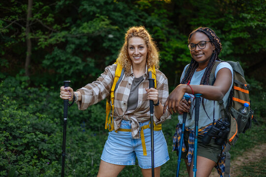 Diverse women friends enjoying a hiking adventure in nature