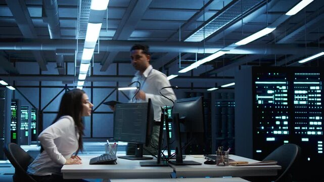 IT team plans disaster recovery for infrastructure in a technical server hub, connecting database reliability, data integrity and technical records inside focused infrastructure maintenance