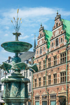 The Stork Fountain and an old brick building in Amagertorv square in central Copenhagen, Denmark