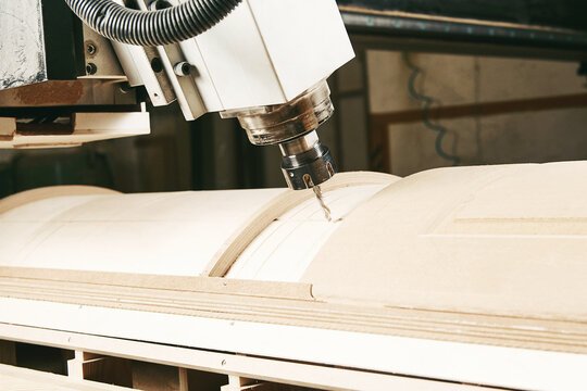 CNC milling machine. Machine tool in wood factory with drilling machines.
