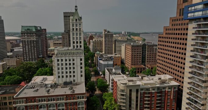 Memphis Tennessee Aerial v41 cinematic fly through downtown district along north main street capturing cityscape with historic buildings and mississippi river view - Shot with Mavic 3 Cine - May 2022