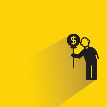 man holding dollar balloon icon with shadow on yellow background