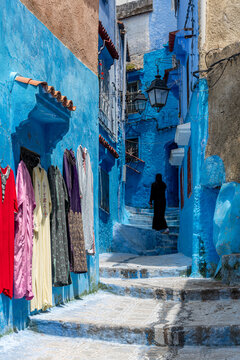 Blue Alley with Colorful Djellabas for Sale, Chefchaouen, Morocco