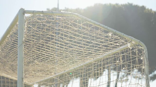 Goal post back lit by the sun