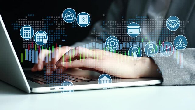 Hands working on a laptop with digital icons showing business activities and data analysis in an office setting during daytime.