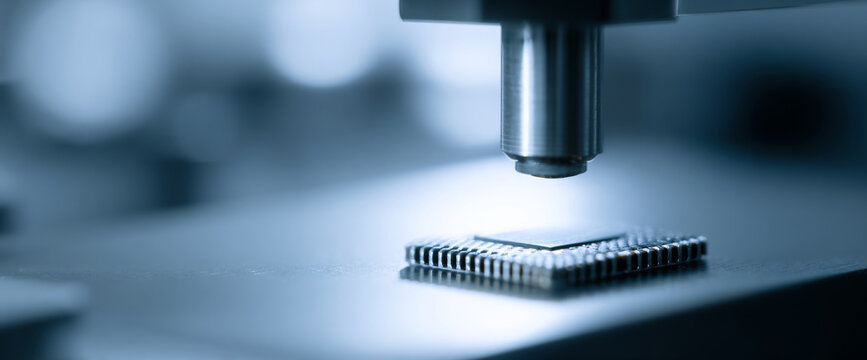 Close-up of microchip under microscope