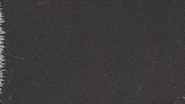 Dark Textured Surface with Dot Pattern and Jagged Edge
