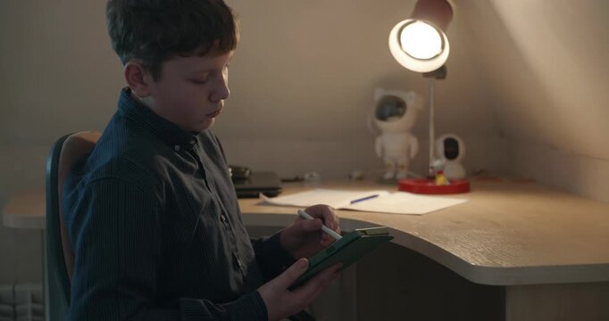 Kid Boy Draw with Stylus Pen on Tablet. 4K 10-bit