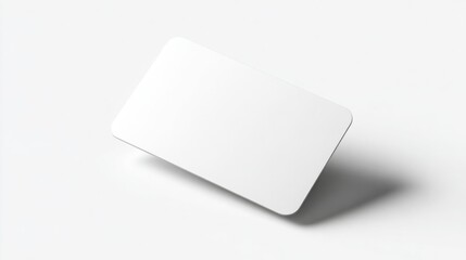 Fototapeta premium Blank white plastic card floating on a clean white background minimal style
