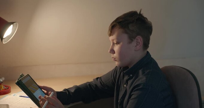 Kid Boy Draw with Stylus Pen on Tablet. 4K 10-bit