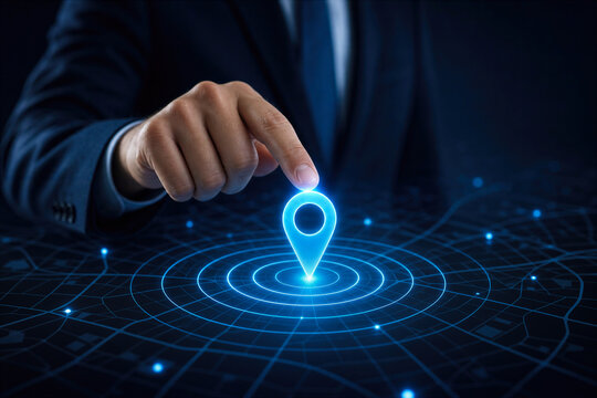 Businessman touching glowing blue location pin on digital map interface with concentric circles for location tracking and geolocation technology concept