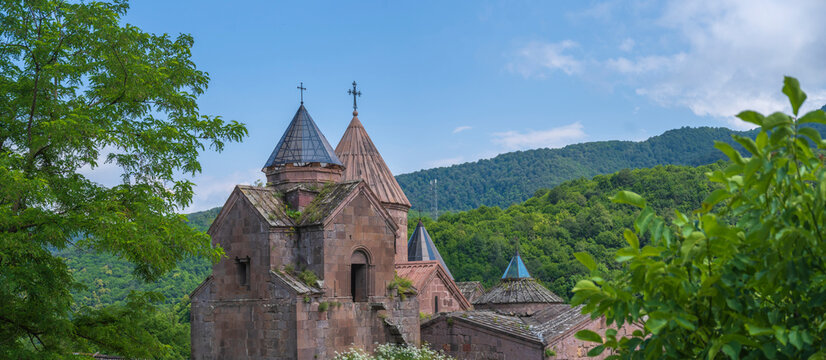 Goshavank monastery panorama in green Dilijan mountains with copy space