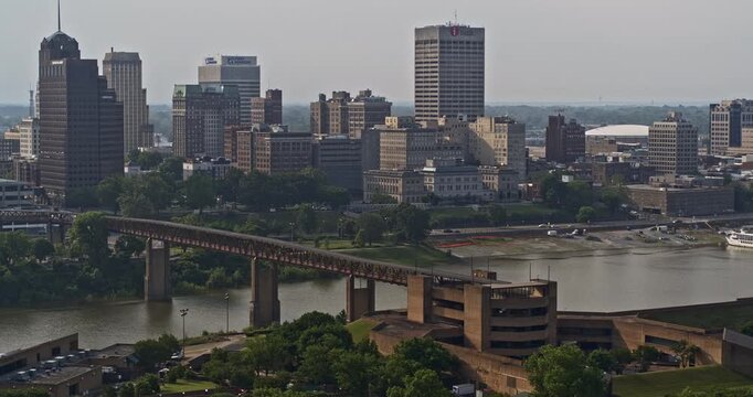 Memphis Tennessee Aerial v65 reverse flyover mississippi river capturing traffic crossing on hernando de soto bridge and downtown cityscape on the skyline - Shot with Inspire 2, X7 camera - May 2022