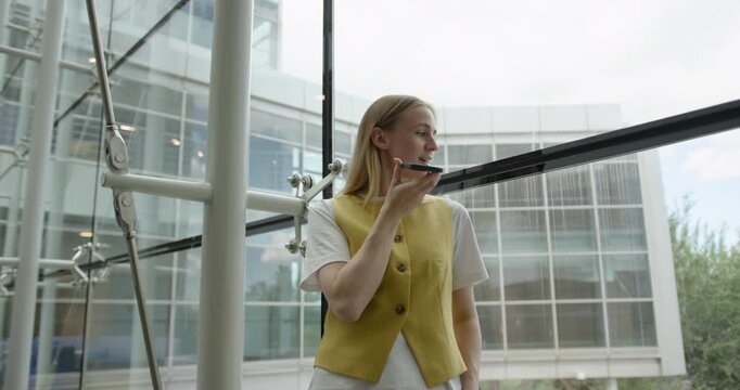 Businesswoman, Speaking on Phone inside Office