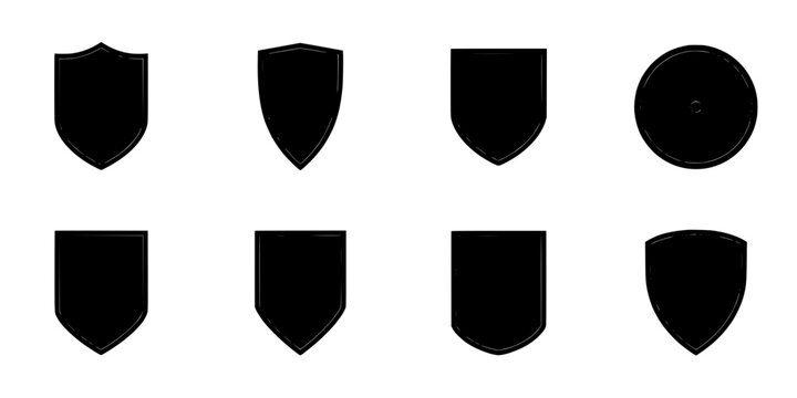 Shields with Various Shapes and a Round Emblem in a Set of Eight Black Icons Featuring Shield, Icon, White with Silhouette