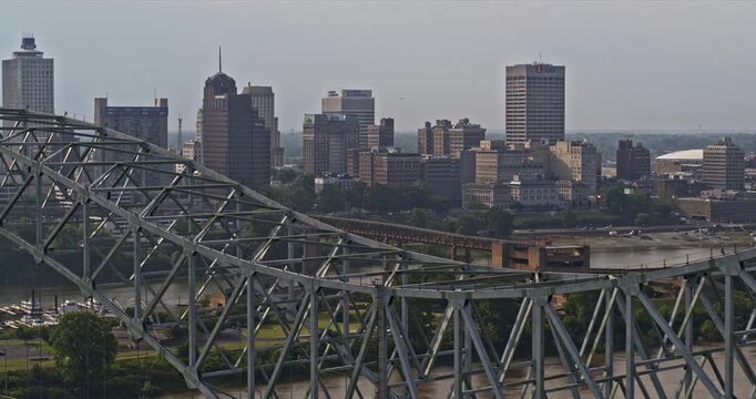 Memphis Tennessee Aerial v66 low flyover mississippi river along steel structure of hernando de soto bridge capturing downtown cityscape and mud island - Shot with Inspire 2, X7 camera - May 2022