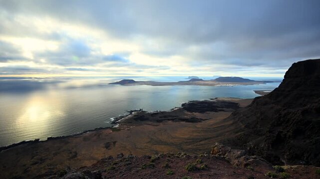Golden Hour Landscape Vista of Risco de Famara Cliffs, El Rio Strait, and the Chinijo Archipelago in Canary Islands