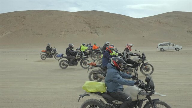 A Shot of Adventure Bikers Group in Cold Desert Landscape of Ladakh India