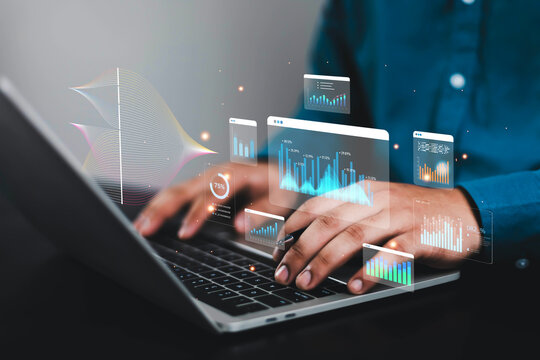 Business analyst using laptop with AI-powered data analytics dashboard, financial charts, KPI metrics, big data visualization, business intelligence, digital transformation and performance monitoring.