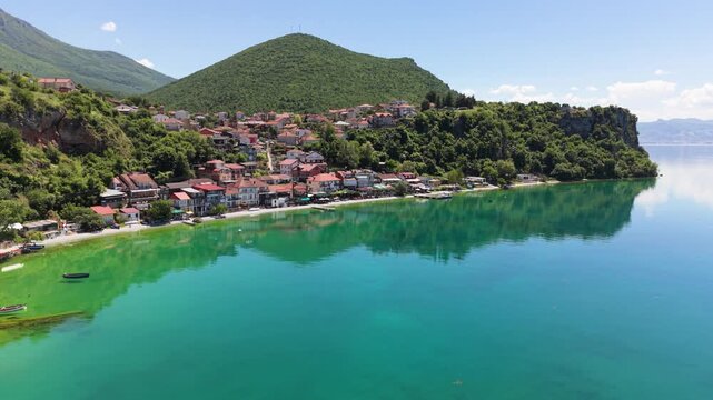 Drone view of Trpejca Beachfront with turquoise water and village shoreline.