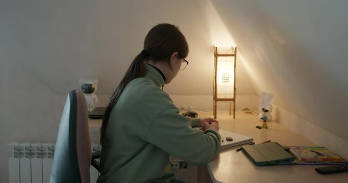 Girl Draw Pictures With Pencil on Desk Table in Bedroom at Home. 4K 10-bit