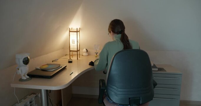 Girl Draw Pictures With Pencil on Desk Table in Bedroom at Home. 4K 10-bit
