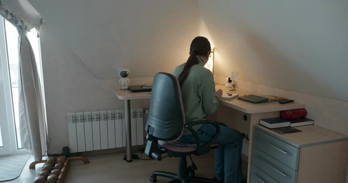 Girl Draw Pictures With Pencil on Desk Table in Bedroom at Home. 4K 10-bit