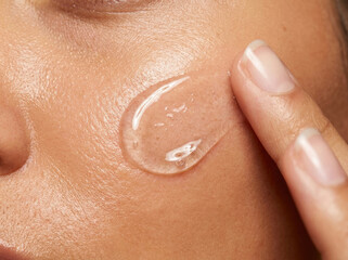 Fototapeta premium Hydrating serum applied on skin, enhancing glow and moisture