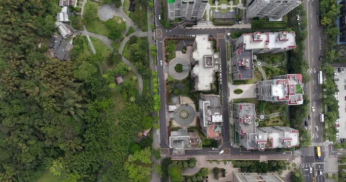 Top down aerial view of Taipei, the vibrant capital city of Taiwan, showing streets, parks and modern skyscrapers in the Xinyi District on a sunny day.