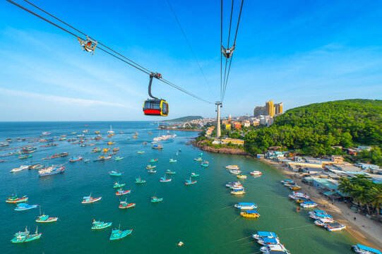 The longest cable car situated on the Phu Quoc Island in South Vietnam and below is traditional fishermen boats lined in the harbor of Duong Dong town in the popular Hon Thom island