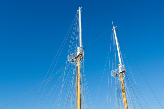 Masts and rigging of a traditional sailing ship against a clear blue sky, Croatia
