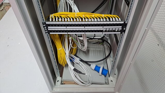 Structured Cabling Patch Panel and Fiber Optic Network Connections in an IDF Rack of a Telecommunications TPS Room