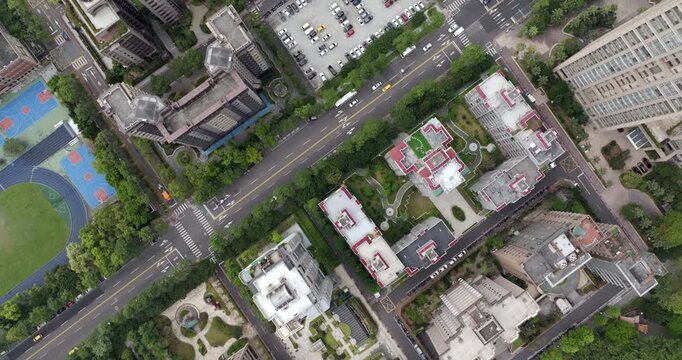Top down aerial view of Taipei, the vibrant capital city of Taiwan, showing streets, parks and modern skyscrapers in the Xinyi District on a sunny day.
