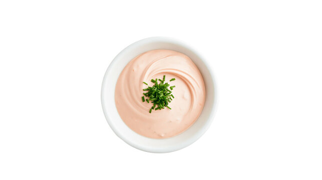 Creamy pink sauce swirled in a white bowl garnished with chopped chives, isolated on transparent background