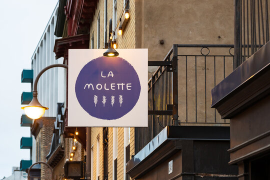 Quebec City, Qu&eacute;bec, Canada, June 27, 2026 -  Low angle view of La Molette restaurant sign seen at dawn at its 249 St-Jean street location