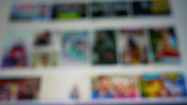 Blurred view of a colorful photo gallery or website thumbnails on a screen