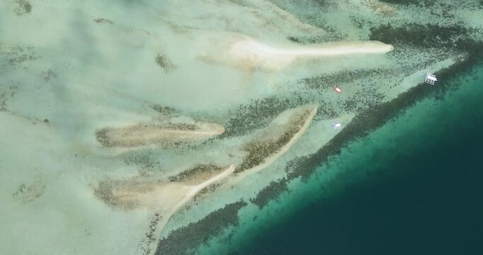 Aerial drone of sandbar and coral reef in turquoise water. Negros, Philippines.