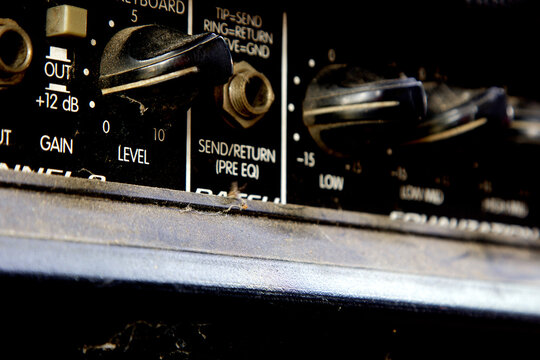Volume and control knobs of an old amplifier.