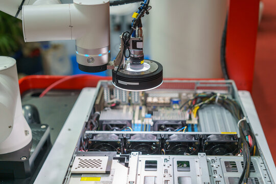 Machine Vision Camera on Robotic Arm Inspecting Electronics