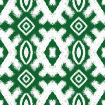 Green and white ikat geometric seamless pattern background with traditional ethno tribal elements for textile print or fashion wrapping paper