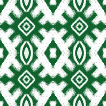 Green and white ikat geometric seamless pattern background with traditional ethno tribal elements for textile print or fashion wrapping paper