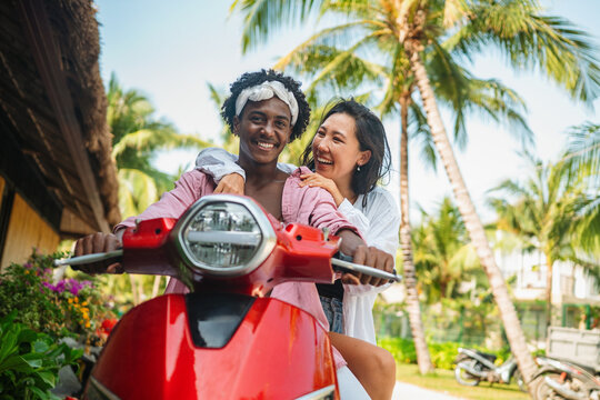 Joyful connection and mindfulness moment during a peaceful morning ride on a beach resort island