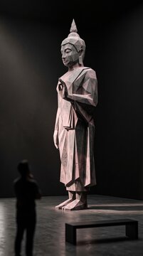 Modern Low-Polygon Pink Buddha Sculpture in Gallery Setting